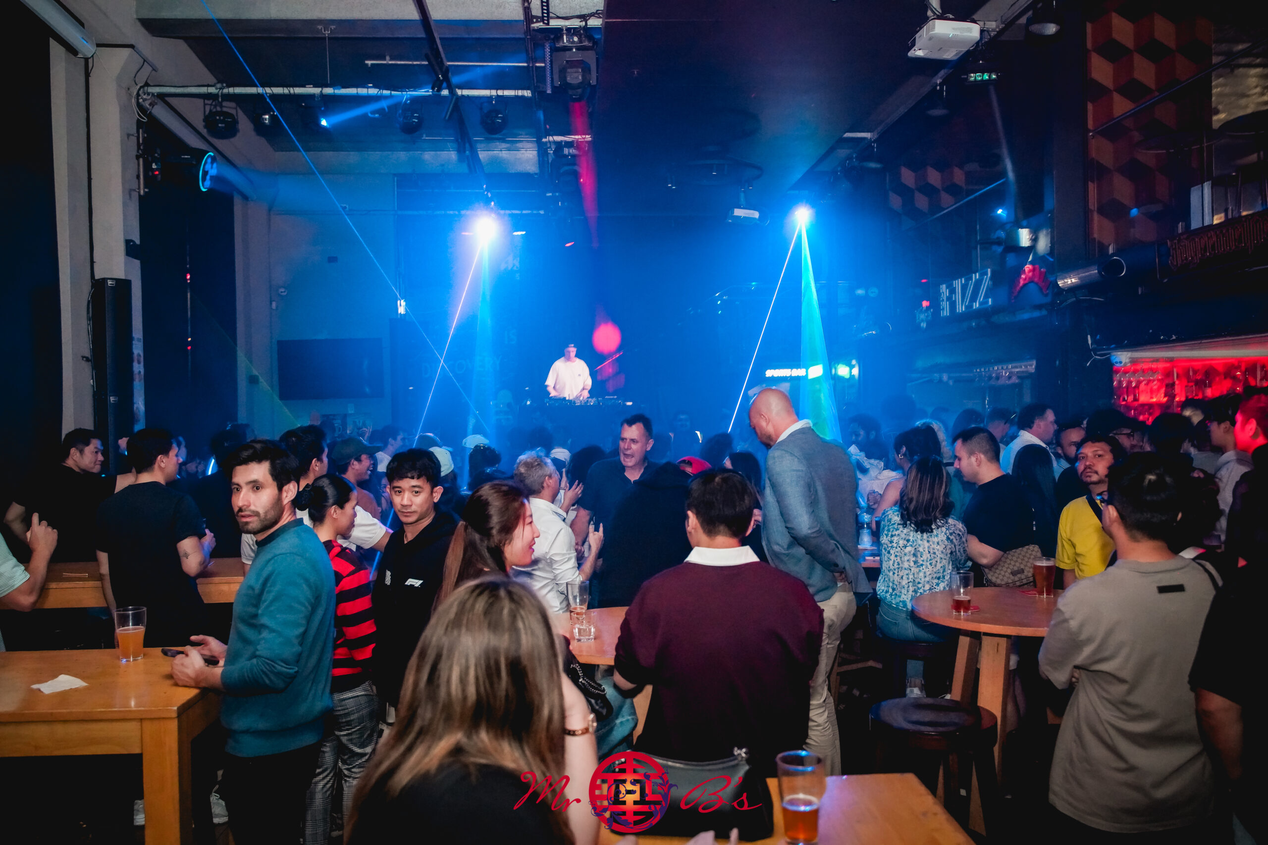 A night at Mr B’s Hotel with guests, a DJ and blue stage lights
